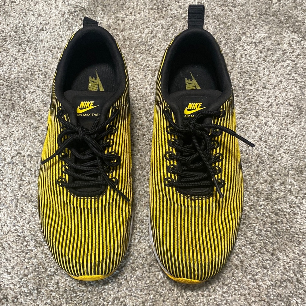 Black and yellow Nikes
